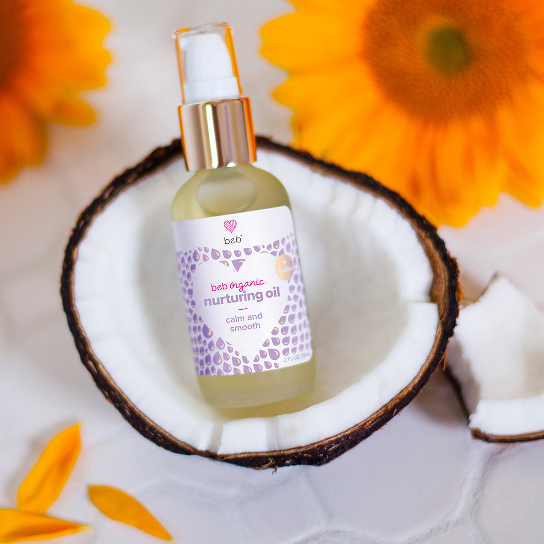 BEB Organic Nurturing Oil sits in half a coconut 